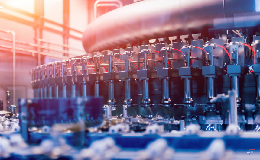Automated manufacturing machinery operating at scale, symbolizing the risks and complexities of rapid production growth