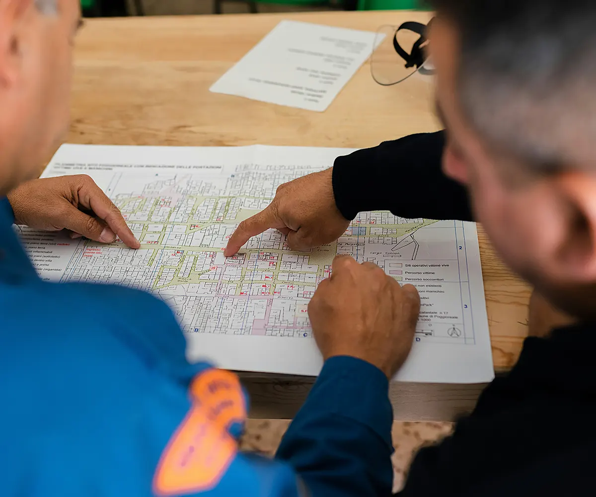 construction-managers-site-planning Construction project managers reviewing site plans and infrastructure layout