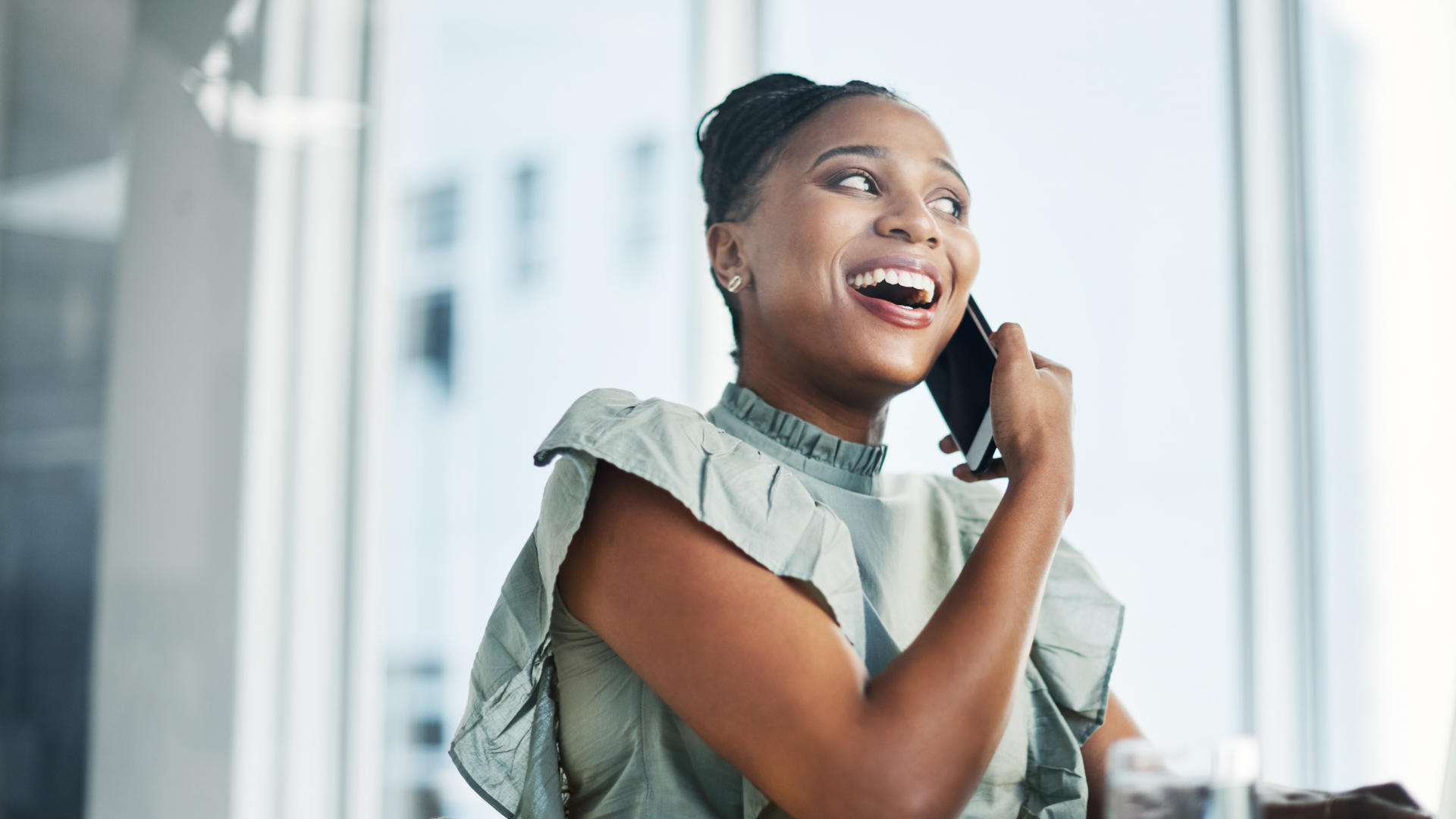 cloud-services-client-phone-support-success Happy client on phone receiving expert cloud services support