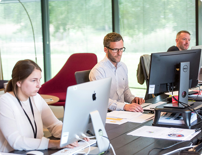 managed-it-services-office-support-team Managed IT services team monitoring systems and supporting clients from office