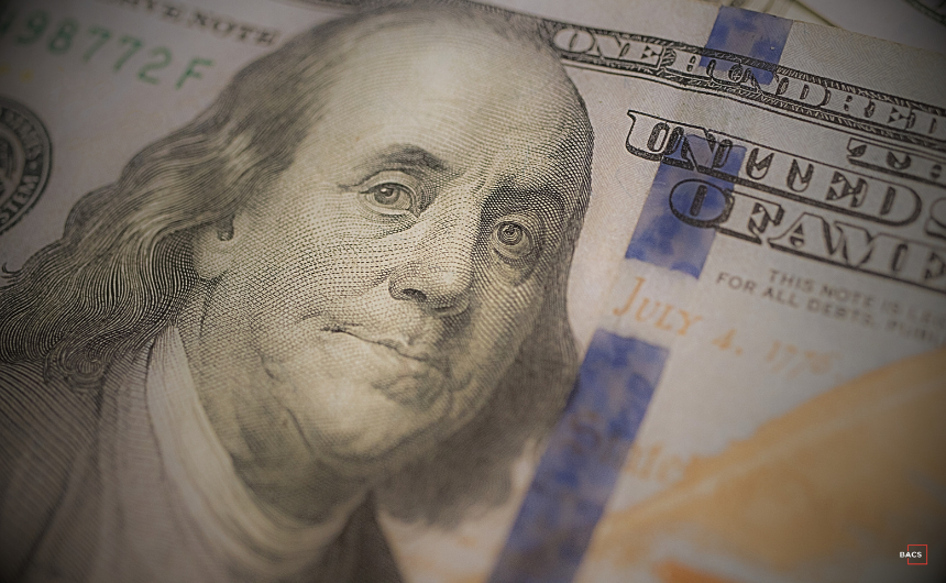 Close-up of Benjamin Franklin on a hundred-dollar bill representing startup funding and intentional technical debt strategy