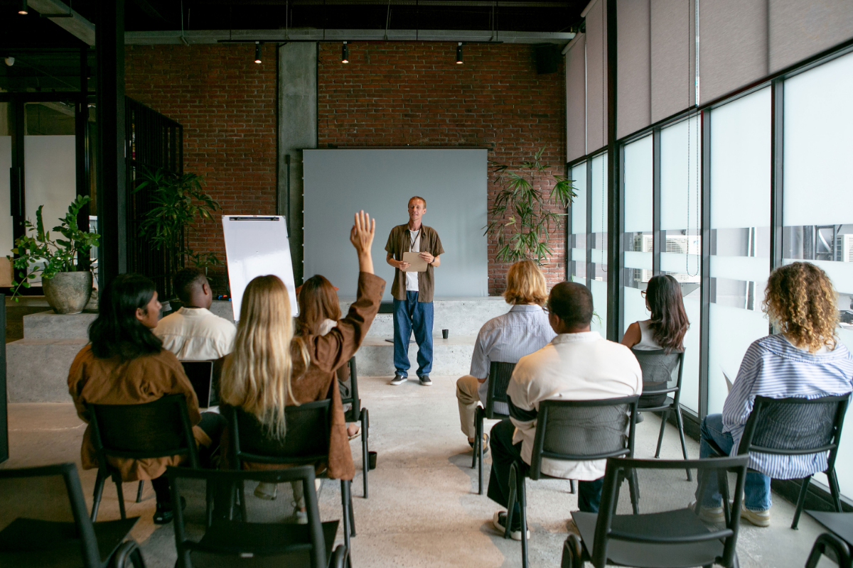 Employees attending a workplace meeting about AI adoption challenges and organizational change initiatives