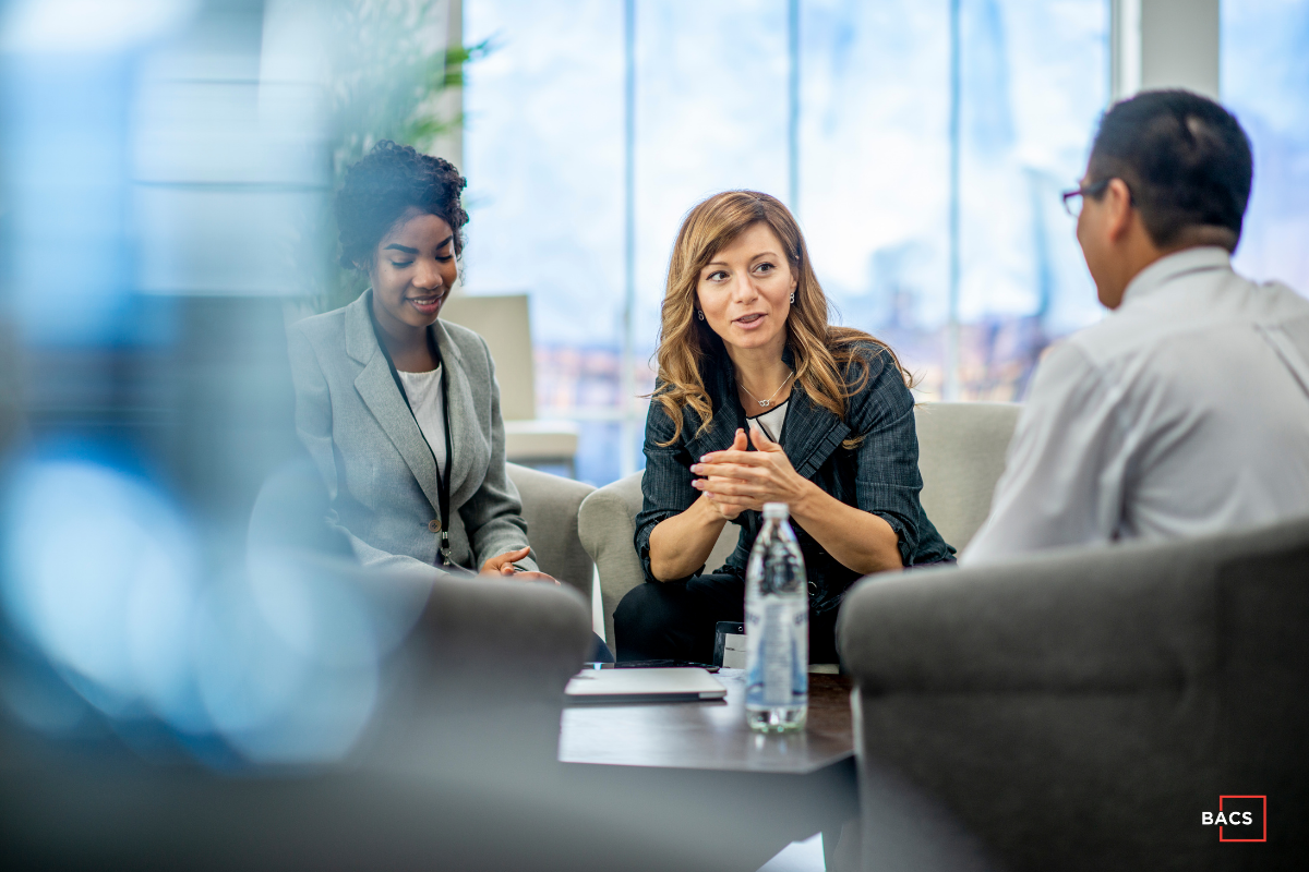 Business leaders discussing AI readiness questions in a strategy meeting