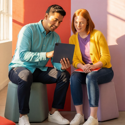 Business professionals reviewing automation and AI solutions on a tablet.
